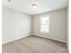 Neutral bedroom with carpeting, a window for natural light, and fresh paint at 673 Shellbark Dr, Concord, NC 28025