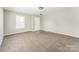 Bright living room with carpet and a front-facing window providing ample natural light at 673 Shellbark Dr, Concord, NC 28025