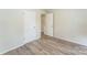 Clean, light filled bedroom with light-colored walls and flooring at 711 September Ln, Charlotte, NC 28208