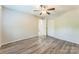 A bedroom features neutral walls, updated vinyl flooring, and a double door closet at 711 September Ln, Charlotte, NC 28208