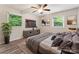 Comfortable bedroom with natural light, hardwood flooring, and a ceiling fan at 711 September Ln, Charlotte, NC 28208