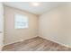 Bright bedroom features a window providing ample natural light at 711 September Ln, Charlotte, NC 28208