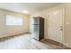 Spacious kitchen with stainless steel refrigerator and exterior door leading to backyard at 711 September Ln, Charlotte, NC 28208