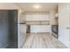 Updated kitchen with stainless steel appliances, granite countertops and modern cabinetry at 711 September Ln, Charlotte, NC 28208
