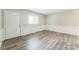 Bright living room boasting neutral walls and flooring, with natural light at 711 September Ln, Charlotte, NC 28208