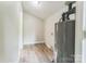The utility room features modern vinyl flooring and space for storage and appliances at 711 September Ln, Charlotte, NC 28208
