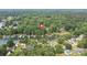 Panoramic aerial showcasing home location with lake access and wooded surroundings at 7232 Executive Cir, Denver, NC 28037