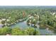 Stunning aerial highlighting the property, nearby docks, and the serene lake environment at 7232 Executive Cir, Denver, NC 28037