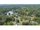 Breathtaking aerial shot of the property location, close to lake and surrounded by lush trees at 7232 Executive Cir, Denver, NC 28037