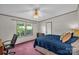 Bedroom with a comfortable bed and views to the front yard, creating a peaceful atmosphere at 7232 Executive Cir, Denver, NC 28037