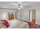 Comfortable bedroom boasts a plush bed and multiple entryways, providing easy access throughout the home at 7232 Executive Cir, Denver, NC 28037