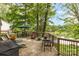 Spacious wooden deck with comfortable seating and stunning lake views perfect for outdoor entertaining at 7232 Executive Cir, Denver, NC 28037