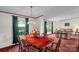 Spacious dining area with a wooden table, comfortable seating, and natural light at 7232 Executive Cir, Denver, NC 28037