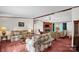 Comfortable living room with a fireplace and large windows offering natural light at 7232 Executive Cir, Denver, NC 28037