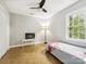 Bedroom featuring hardwood floors, a ceiling fan, and natural light at 7317 Red Branch Ln, Charlotte, NC 28226