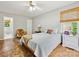 Comfortable bedroom featuring hardwood floors, a ceiling fan, and neutral walls at 7317 Red Branch Ln, Charlotte, NC 28226