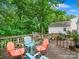 Deck featuring outdoor seating with a glass table, ideal for outdoor dining and relaxation at 7317 Red Branch Ln, Charlotte, NC 28226