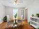 Cozy dining area with hardwood floors, a round table, and natural light at 7317 Red Branch Ln, Charlotte, NC 28226