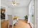 Dining area featuring hardwood floors, natural light, and a modern ceiling fan at 7317 Red Branch Ln, Charlotte, NC 28226