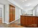 Open kitchen featuring a center island with cabinets and tile flooring throughout at 7317 Red Branch Ln, Charlotte, NC 28226