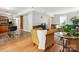 Open-concept living area connects to a kitchen with an eating area and wood floors for seamless flow and entertaining at 7317 Red Branch Ln, Charlotte, NC 28226