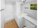 Clean bathroom with modern vanity, tiled shower/tub, and ample natural light at 7737 Batavia Ln, Charlotte, NC 28213