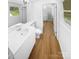 Well-lit bathroom boasts a sleek vanity, modern fixtures, and convenient access to additional rooms at 7737 Batavia Ln, Charlotte, NC 28213