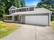 Charming two-story home features a wide driveway, two-car garage, and a well-maintained lawn, adding to its curb appeal at 7737 Batavia Ln, Charlotte, NC 28213