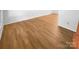 Close-up of the newly installed and gleaming hardwood flooring throughout the home at 7737 Batavia Ln, Charlotte, NC 28213