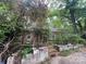 Secluded property with brick home set amongst the trees and foliage at 7949 Ritter Dr, Charlotte, NC 28270