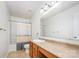 Bright bathroom with a vanity, mirror, and a shower-tub combination with a curtain at 826 Sinclair Dr, Monroe, NC 28112