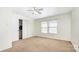 Bedroom with large windows, neutral walls, double door closet, and ceiling fan at 826 Sinclair Dr, Monroe, NC 28112