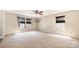 Bedroom with neutral carpet, tan walls, three windows, and brown window treatments at 826 Sinclair Dr, Monroe, NC 28112