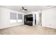 Spacious bonus room with a ceiling fan, two windows, carpet floors, and a built-in cabinet at 826 Sinclair Dr, Monroe, NC 28112