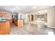 Open concept living room with breakfast bar, and large windows letting in ample natural light at 826 Sinclair Dr, Monroe, NC 28112