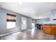 Open living space with access to kitchen and back door, features light gray walls and natural light at 826 Sinclair Dr, Monroe, NC 28112