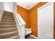 Stairway with carpeted steps, white banister, and an accent wall at 826 Sinclair Dr, Monroe, NC 28112
