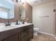 Bathroom with double sink vanity, tile floors, and a separate shower area at 9348 Golden Pond Dr, Charlotte, NC 28269