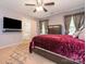 This primary bedroom offers a ceiling fan, a walk-in closet, and an ensuite bathroom at 9348 Golden Pond Dr, Charlotte, NC 28269