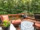 Spacious wooden deck with outdoor seating, grill, and lush green surroundings, great for entertaining at 9348 Golden Pond Dr, Charlotte, NC 28269