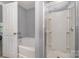 Bright bathroom featuring a soaking tub and a separate glass-enclosed shower at 9524 Eagle Feathers Dr, Charlotte, NC 28214