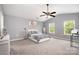 Spacious bedroom features vaulted ceilings, neutral paint, and two sunny windows at 9524 Eagle Feathers Dr, Charlotte, NC 28214