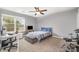 Bedroom featuring a ceiling fan, a desk near the window, and a drum set at 9524 Eagle Feathers Dr, Charlotte, NC 28214