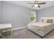 Bedroom with neutral walls, carpet, ceiling fan and plenty of natural light at 9524 Eagle Feathers Dr, Charlotte, NC 28214