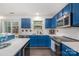 Beautiful kitchen with blue cabinets, stainless steel appliances, white countertops, and subway tile backsplash at 9524 Eagle Feathers Dr, Charlotte, NC 28214
