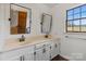 Well-lit bathroom with double sinks and a vanity, offering a comfortable space at 956 Stony Point Rd, Kings Mountain, NC 28086