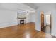 Bright living room featuring hardwood floors and a charming brick fireplace at 956 Stony Point Rd, Kings Mountain, NC 28086