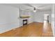 Spacious living room showcasing a brick fireplace and hardwood floors at 956 Stony Point Rd, Kings Mountain, NC 28086