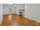 Bright living room with hardwood floors and a brick fireplace, offering ample natural light at 956 Stony Point Rd, Kings Mountain, NC 28086