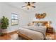 Cozy main bedroom with hardwood floors, a large window, and stylish decor at 956 Stony Point Rd, Kings Mountain, NC 28086